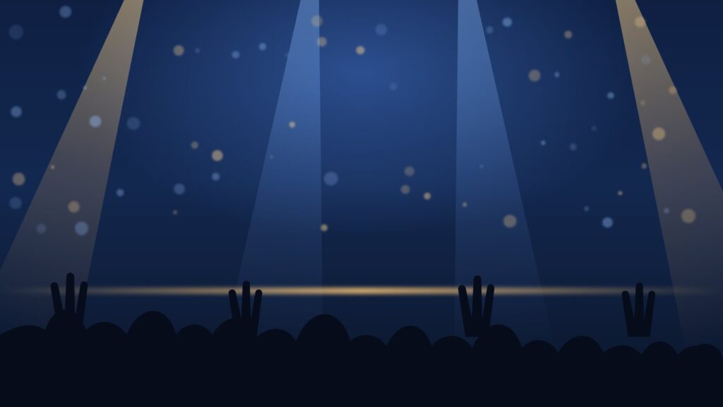 Stage lights over a crowd with raised hands